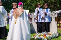 Bishop-Ricken-Praying-at-Grave-of-Adele-Brice